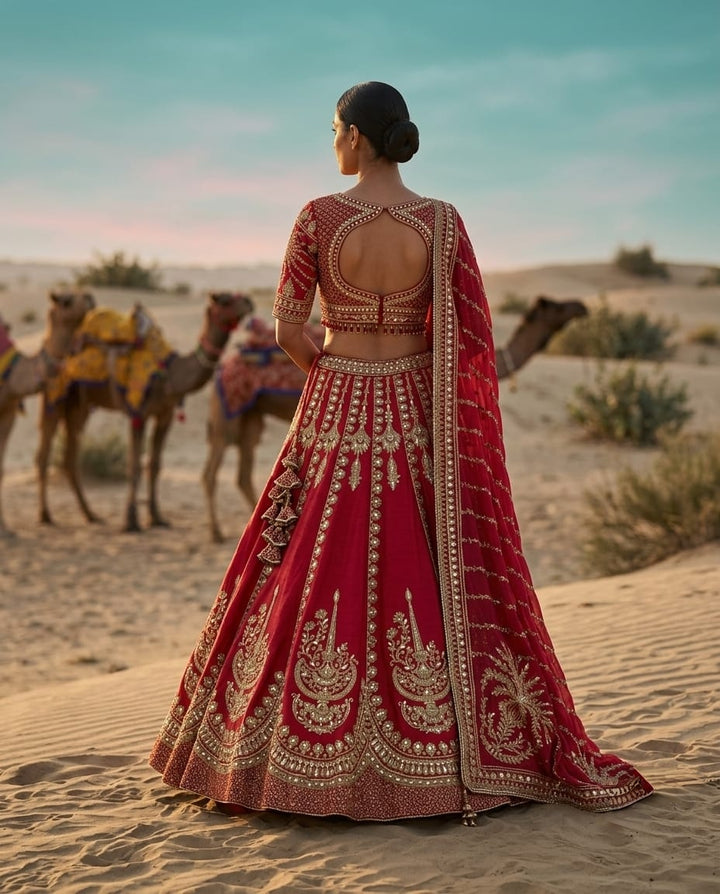 Elegant pink crepe lehenga with heavy embroidery for a royal festive look.
