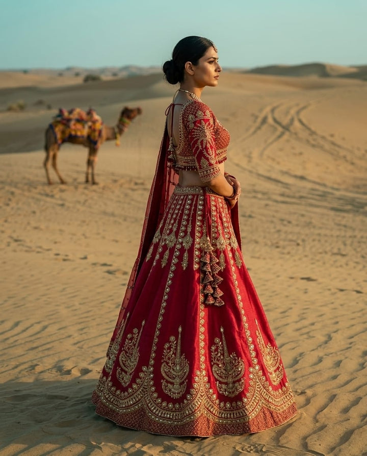 Elegant pink crepe lehenga with heavy embroidery for a royal festive look.