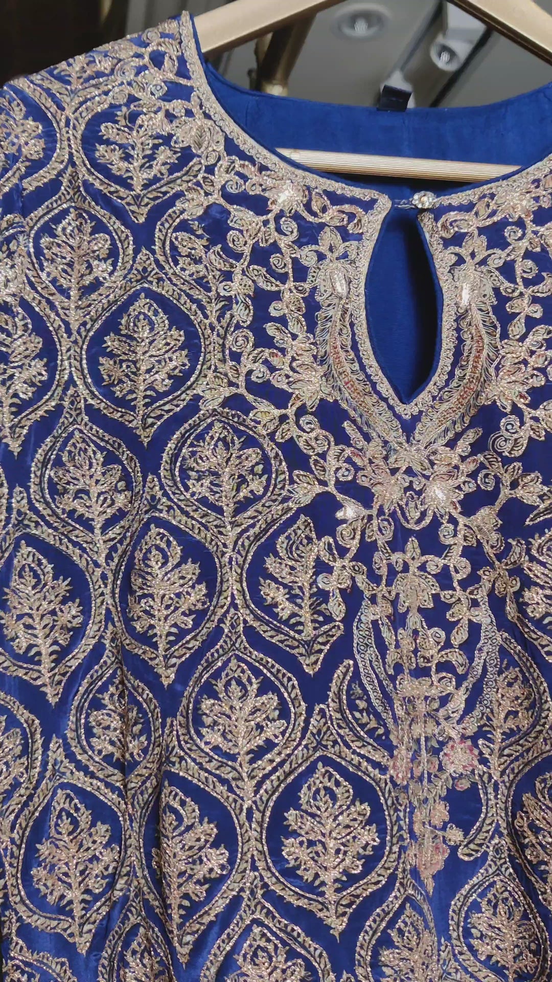 Elegant navy blue crepe suit with farshi salwar, adorned with intricate gotta and zari work.