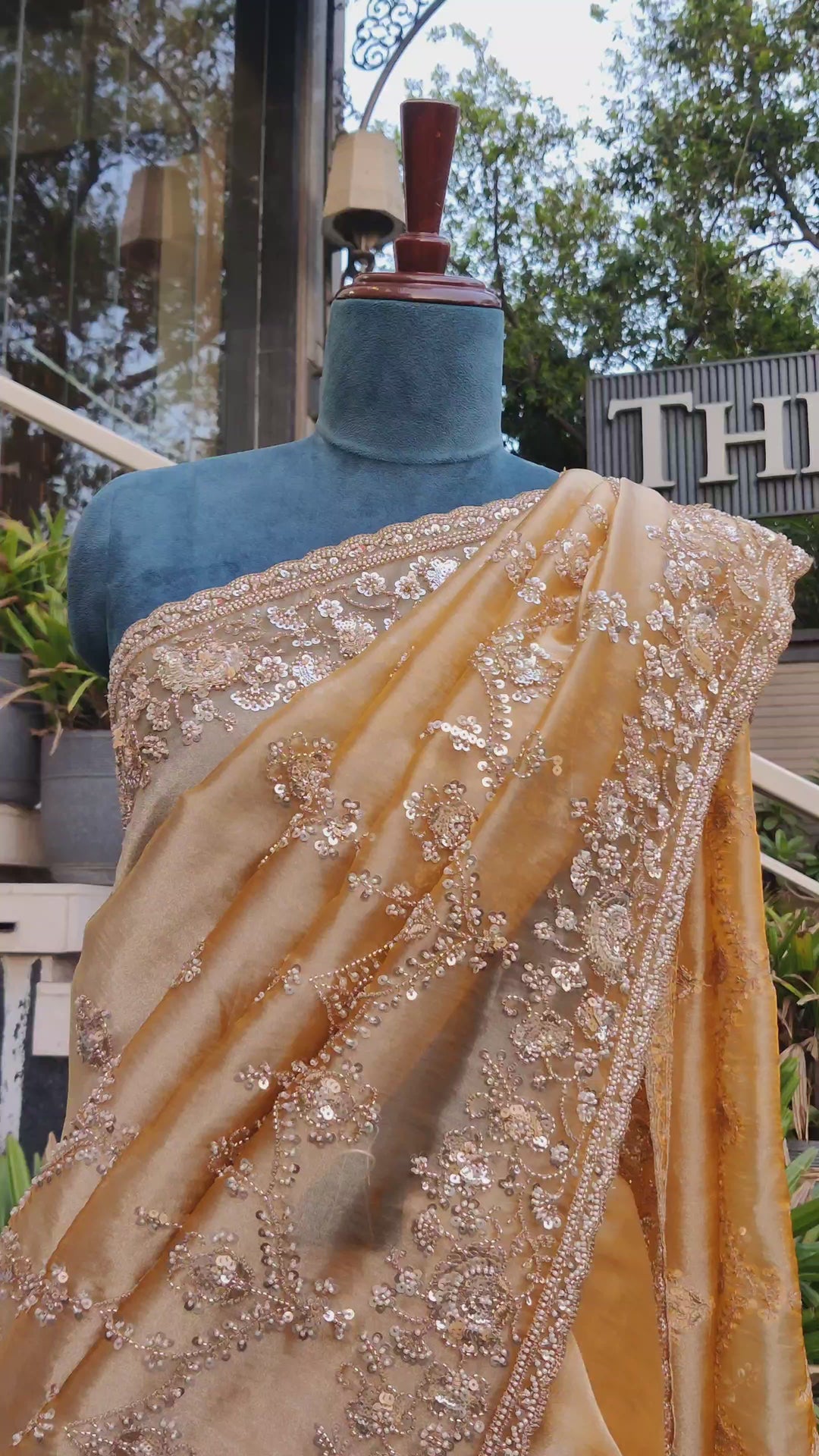 Golden Organza Saree with bead & sequin embroidery and unstitched blouse.