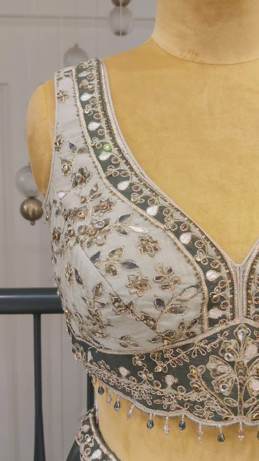 Olive Green Crepe Lehenga with heavy dori embroidery.